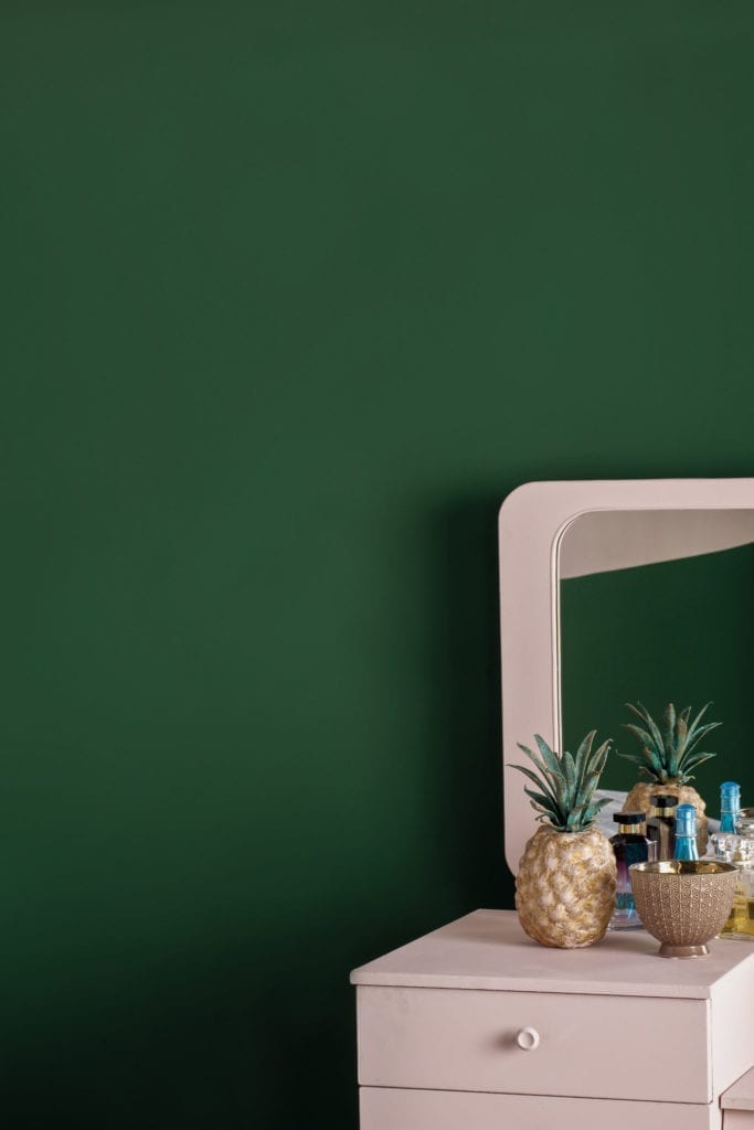 Mirrored table painted with Chalk Paint® by Annie Sloan in Antoinette with Amsterdam Green Wall Paint in a colour blocked bedroom