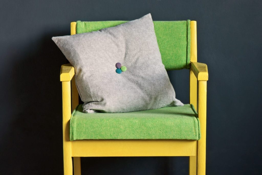 Bohemian warehouse chair painted with Chalk Paint® by Annie Sloan in English Yellow and covered with Linen Union fabric in English Yellow + Antibes Green. Wall Paint in Graphite.