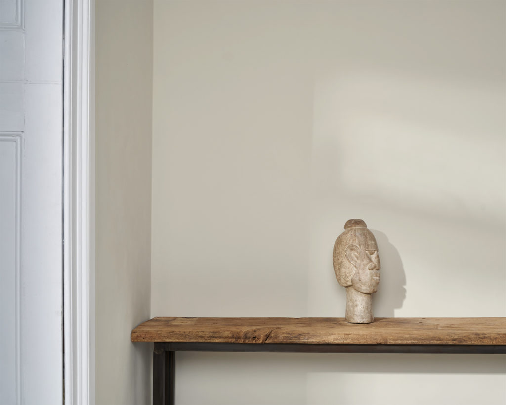 Old White Wall Paint by Annie Sloan on a wall behind bench