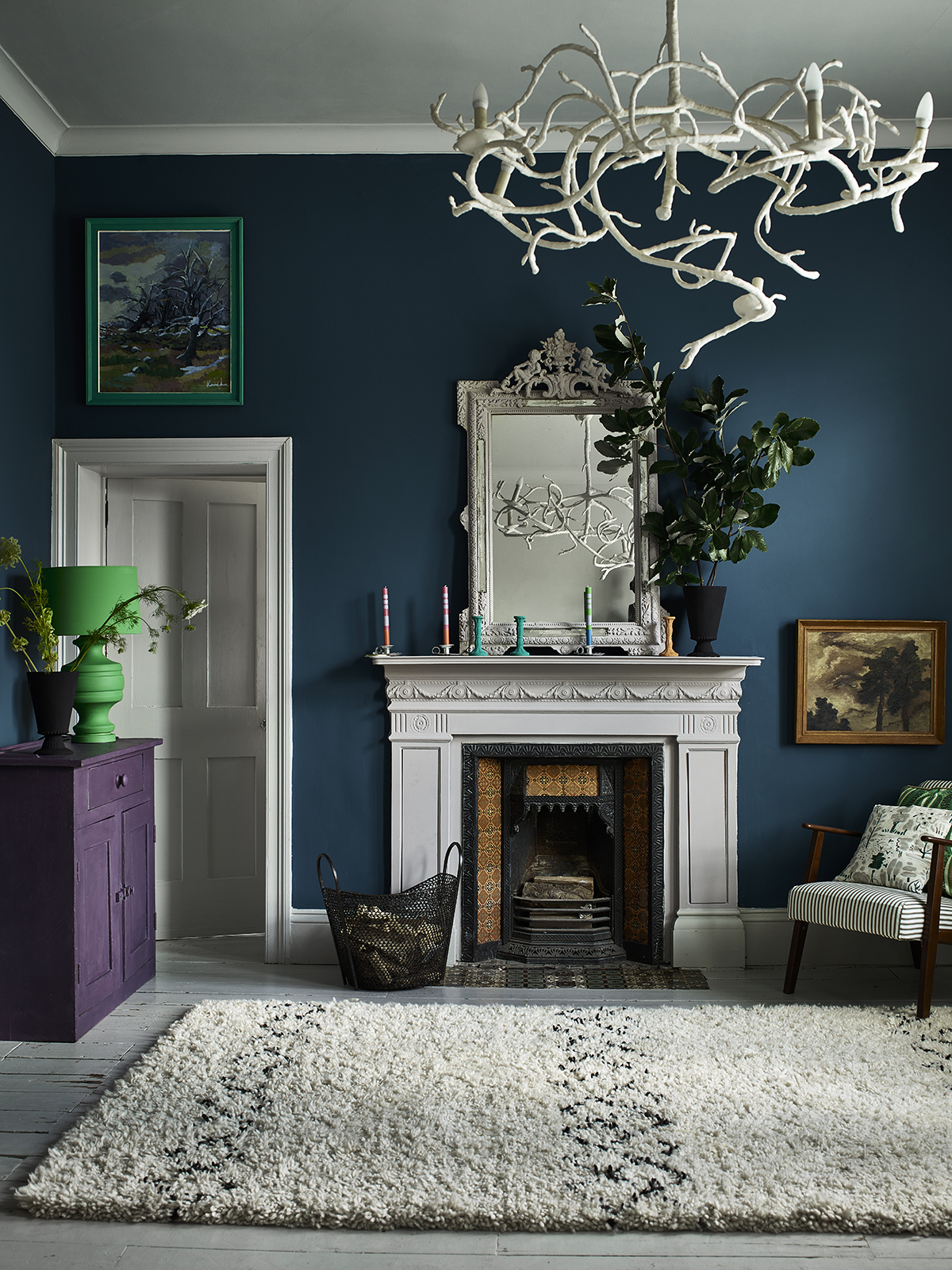 Annie Sloan Living Room Aubusson Blue Wall Paint with Paloma Chalk Paint fireplace and mirror and featuring a Giverny Chalk Paint lamp, Rodmell chest, and Dulcet cushion