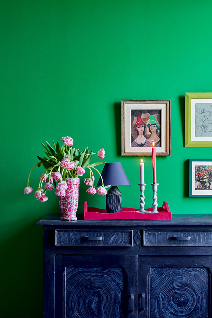 Annie Sloan Schinkel Green Wall Paint has been used to paint a living room. Features a sideboard painted in Chalk Paint® in Oxford Navy and Old White.