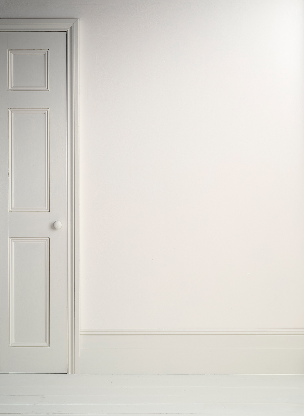 Lifestyle Image of Annie Sloan Satin Paint in Pure used on door and skirting