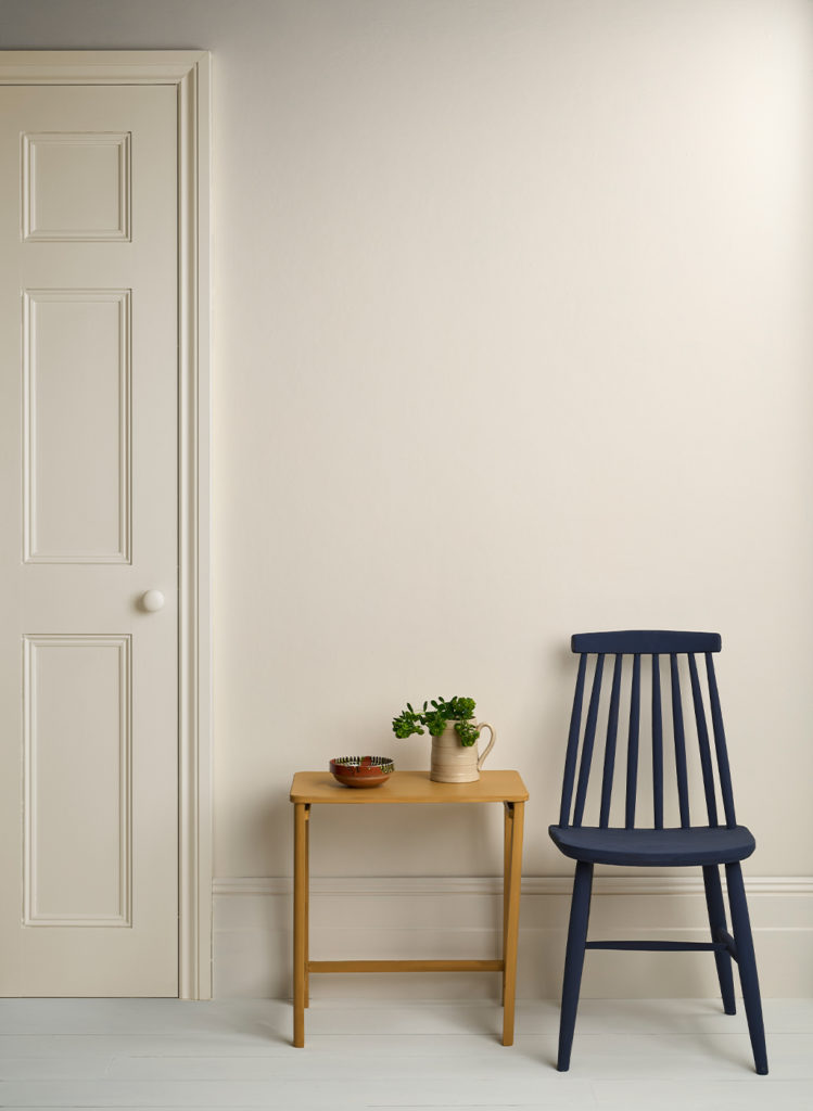 Lifestyle Image of Annie Sloan Satin Paint in Original used on door and skirting