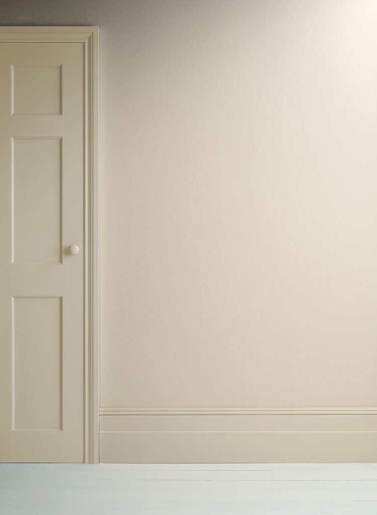 Lifestyle Image of Annie Sloan Satin Paint in Canvas used on door and skirting