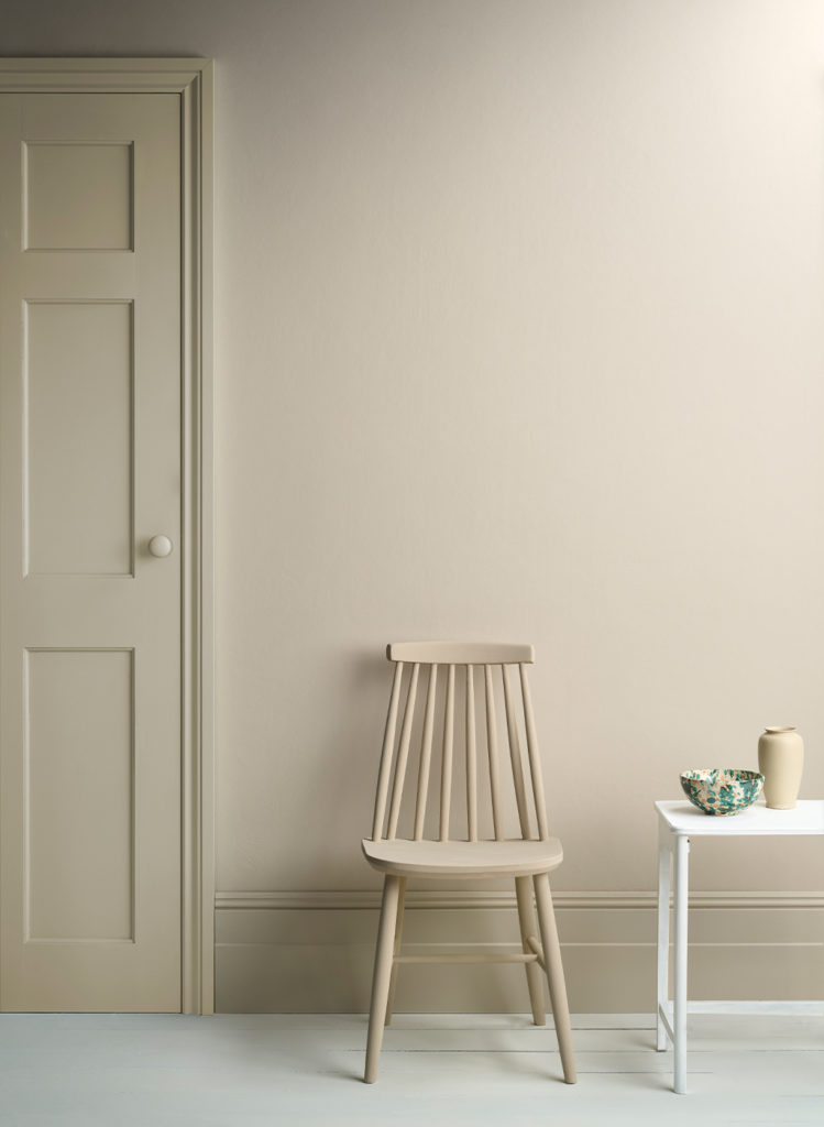 Lifestyle Image of Annie Sloan Satin Paint in Canvas used on door and skirting