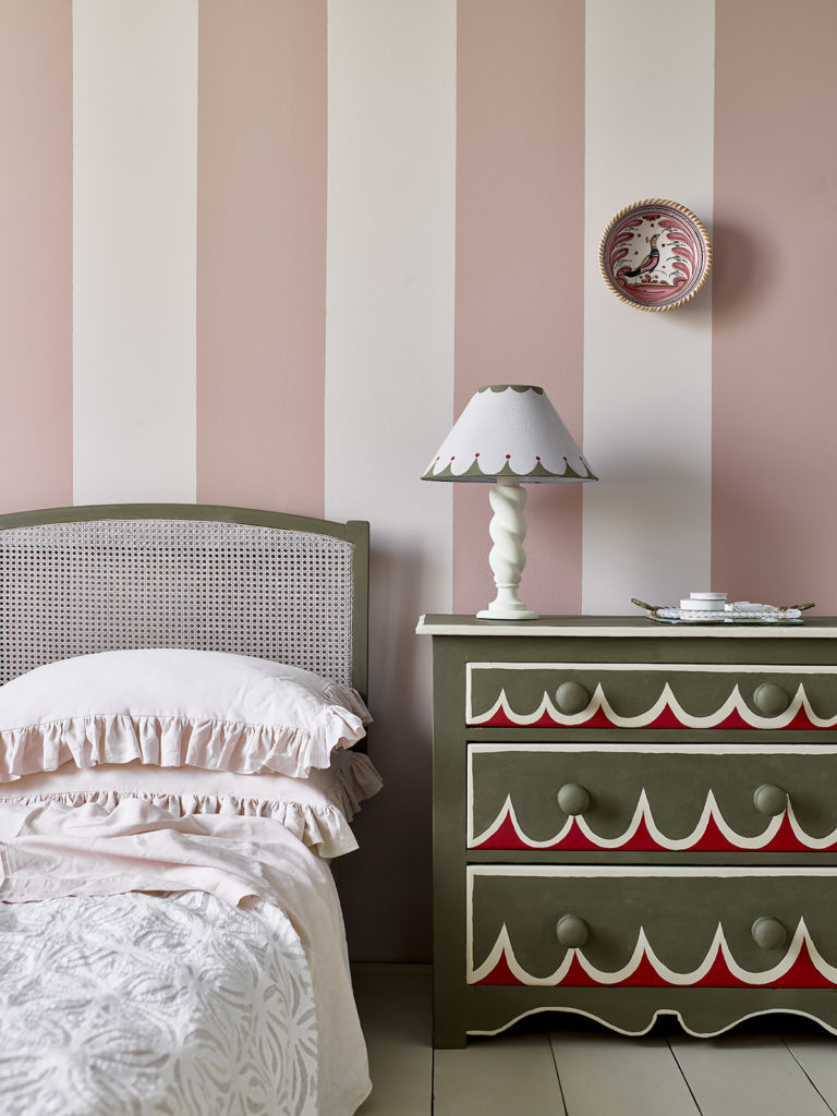 Piranesi Pink Striped Bedroom Featuring Olive Painted Chest of Drawers