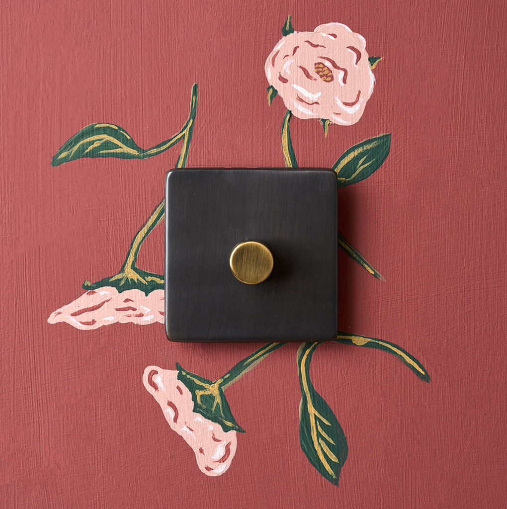 Annie Sloan Wall Paint used to create a rose around a light switch